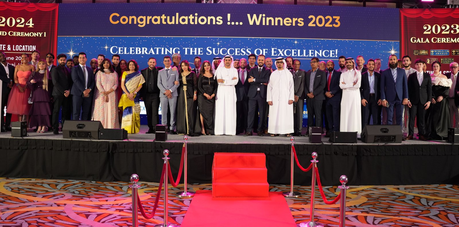 Award winners on stage at a premium business awards ceremony in Dubai
